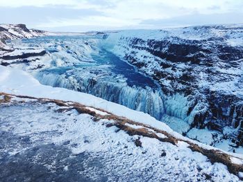 Scenic view of frozen lake against sky