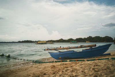 View of calm beach against the sky