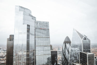 Modern buildings in city against sky