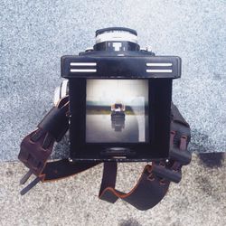 Close-up of camera on white background