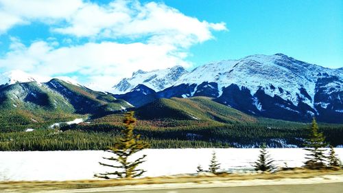 Scenic view of snowcapped mountains against sky