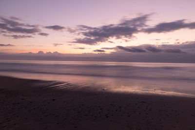 Scenic view of beach against sky during sunset