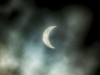Low angle view of half moon in sky