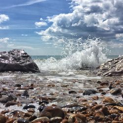 Waves splashing on rocks at beach