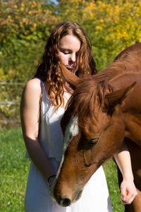 Beautiful young woman in grass