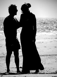 Silhouette couple standing outdoors