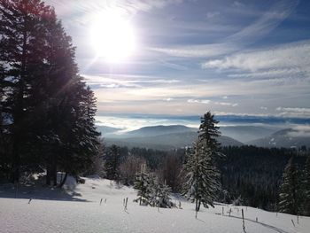 Scenic view of snowcapped mountains against sky during winter