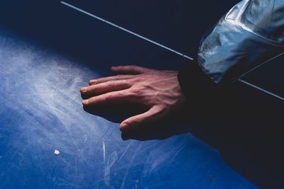 Cropped image of person hand on table