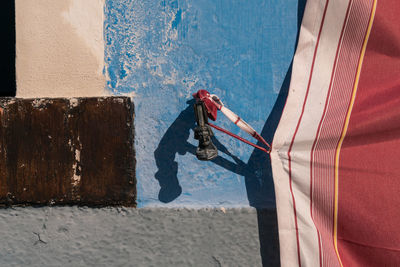 Close-up of man with shadow on water