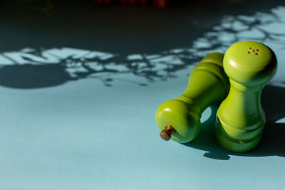 High angle view of yellow toy floating on table