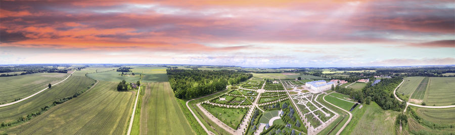 High angle view of agricultural field against sky during sunset