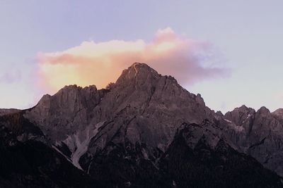 Scenic view of rocky mountains against sky during sunset