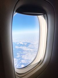 Clouds seen through airplane window