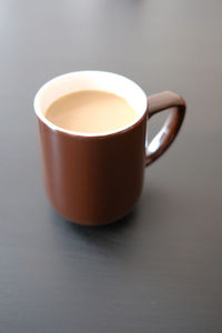 High angle view of coffee cup on table