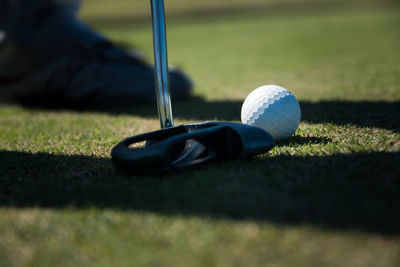 Close-up of golf ball on field