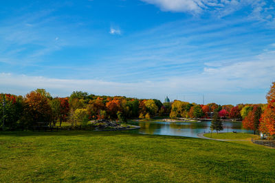 Scenic view of lake by trees against sky during autumn