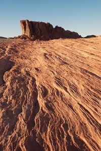 Low angle view of rock formation against clear sky