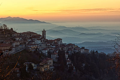 High angle view of townscape against sky during sunset