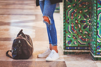 Low section of woman standing on floor