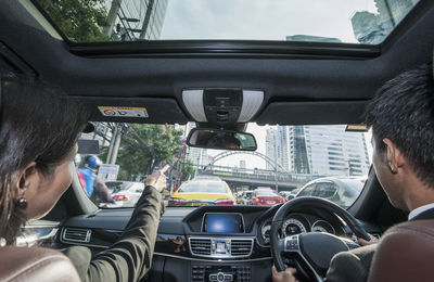 Rear view of man traveling in car