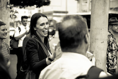 Rear view of people against blurred background