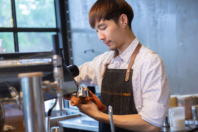 Man working on glass