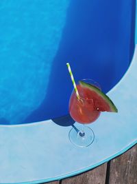 High angle view of drink in glass at poolside