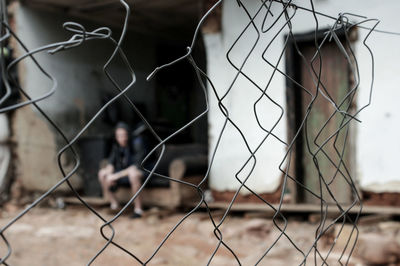 Close-up of damaged chainlink fence