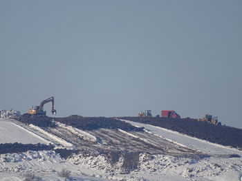 Panoramic view of construction site against clear sky