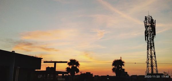 Low angle view of silhouette buildings against sky during sunset