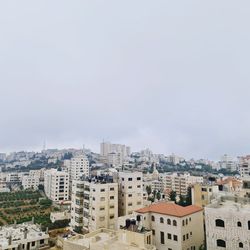 Buildings in city against sky