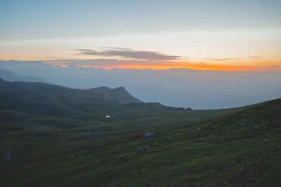 Scenic view of landscape against sky during sunset