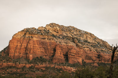 Sedona rock formations on mountain against sky