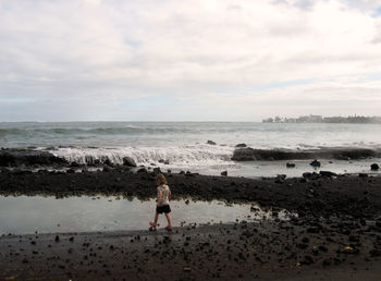 Scenic view of sea against cloudy sky