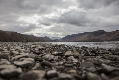 Surface level of stones against sky