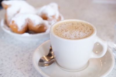 Close-up of cappuccino served on table