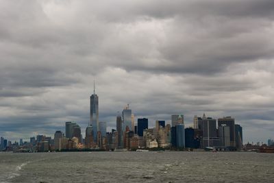 City skyline against cloudy sky