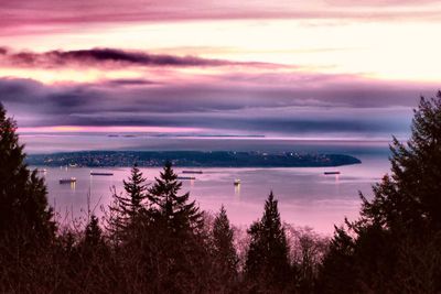 Scenic view of lake against sky at sunset