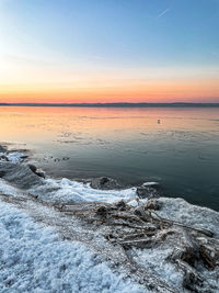 Scenic view of sea against sky during sunset