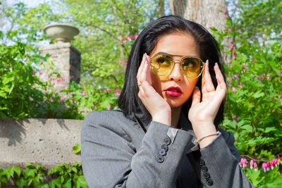 Portrait of young woman wearing sunglasses