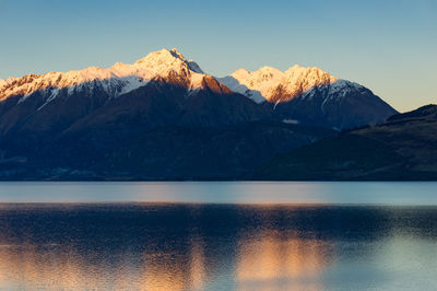 Scenic view of snowcapped mountains against sky during winter