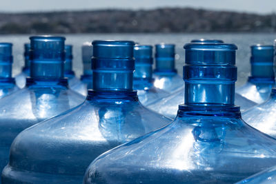Close-up of water bottle against blue background
