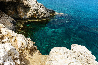 High angle view of rock formation in sea