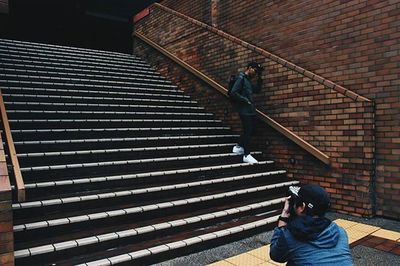 Full length of woman walking on steps