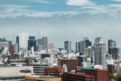 High angle view of buildings in city against sky