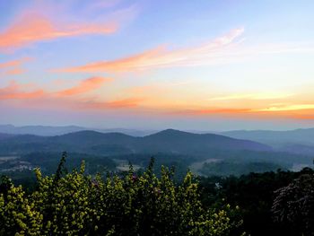 Scenic view of mountains against sky during sunset