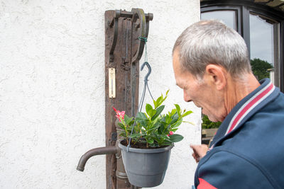 Side view of young man working at home