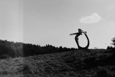 Person riding bicycle on field