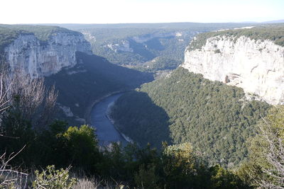 High angle view of river amidst mountains