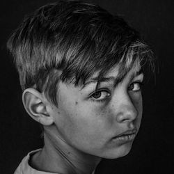 Close-up portrait of boy looking away